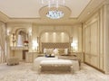 Luxury bed in a large neoclassical bedroom with decorative niche