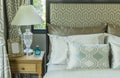 Luxury bedroom with pillows and desk lamp Royalty Free Stock Photo