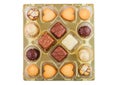 Luxury belgian chocolate and biscuit cookies selection in original golden tray and white background.