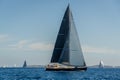 Luxury big sailing yacht with black sails.