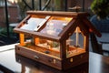 luxury birdhouse with heated seed tray and glass panels for a view of the interior