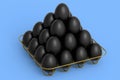 Luxury black eggs standing in pyramid in metal tray for morning breakfast
