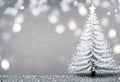 Christmas tree with snowflakes and bokeh on grey background