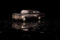Luxury black USSR car die-cast model on the black reflective background Royalty Free Stock Photo