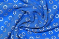 Luxury blue fabric with golden rings Royalty Free Stock Photo