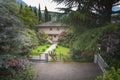 Luxury blue house with beautiful landscaping on a sunny day Royalty Free Stock Photo