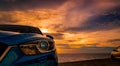 Luxury blue SUV car parked on the road beside tropical beach with beautiful sunset sky. New car with sport and modern design. Car Royalty Free Stock Photo