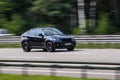 Luxury car BMW speeding on empty highway