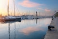 Luxury boats moored in the port. View of the harbor at sunset. Lifestyle, vacation concept Royalty Free Stock Photo