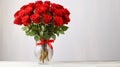 luxury bouquet of fresh red roses in a glass vase on light background, banner, copy space Royalty Free Stock Photo