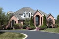 Luxury brick home with cedar roof Royalty Free Stock Photo