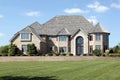 Luxury brick home with cedar roof Royalty Free Stock Photo