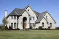 Luxury brick home with cedar roof Royalty Free Stock Photo