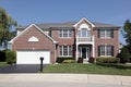 Luxury brick home with front balcony Royalty Free Stock Photo