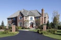 Luxury brick home with front balcony Royalty Free Stock Photo