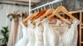 Luxury bridal gowns on hangers in boutique bridal shop, elegant white wedding dresses close up Royalty Free Stock Photo