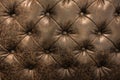 Luxury brown or black leather with button texture background closeup