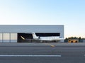 Luxury business jet is being towed out of the hangar Royalty Free Stock Photo