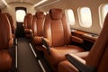 Luxury business jet plane airplane private jet empty interior during flight fast bright luxurious seat leather chair Royalty Free Stock Photo