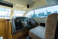 Luxury cabin cruiser out on river. No one sitting in captains seat Royalty Free Stock Photo