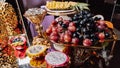 Luxury candy bar on golden wedding. Candy bar decorated by flowers standing of festive table with deserts, and cakes, strawberry Royalty Free Stock Photo
