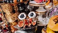 Luxury candy bar on golden wedding. Candy bar decorated by flowers standing of festive table with deserts, and cakes, strawberry Royalty Free Stock Photo