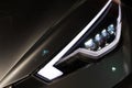 Luxury car headlight detail close-up Royalty Free Stock Photo