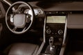 Luxury car inside, automatic gear stick of a modern car. Dark leather interior brown toned image Royalty Free Stock Photo