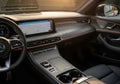Luxury car interior featuring a modern dashboard with a large touchscreen displaying navigation. Royalty Free Stock Photo