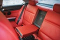Luxury car interior with red leather seats and black details