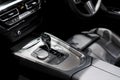 Luxury of car interior at transmission shift gear area. Modern car interior, gearstick radio and air conditioner Royalty Free Stock Photo