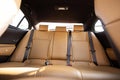 Luxury car rear leather seats row. Interior of new modern clean expensive car. Passenger seats with leather. Closeup Royalty Free Stock Photo