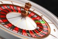 Luxury Casino roulette wheel on black background. Casino theme. Close-up white casino roulette with a ball on 21. Poker