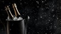 luxury and celebration with champagne bottles chilling in an ice bucket dramatic dark backdrop Royalty Free Stock Photo