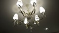 Luxury Chandelier. Close-up shot of modern lighting lamp with light bulbs on on a ceiling Royalty Free Stock Photo