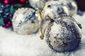Luxury Christmas ball in the snow and snowy abstract scenes. Christmas ball on glitter background.