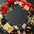 Luxury Christmas frame made of gift boxes, festive decorations, satin ribbon on black table. Christmas, happy new year background Royalty Free Stock Photo