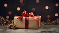 Luxury christmas present wrapped with golden paper. Red ribbon with big bow. Royalty Free Stock Photo