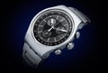 Stainless steel luxury chronograph watch, with deep blue gradient background