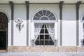 Luxury classic facade. Large window on a white wall background. Vintage backdrop with empty copy space