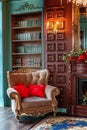 Luxury classic interior of home library. Sitting room with bookshelf, books, arm chair, sofa and fireplace Royalty Free Stock Photo
