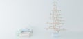 Luxury composition of colored pastel paints, metallic, glass decorations, gifts, stars and minimalistic christmas tree