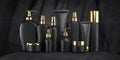 Luxury cosmetic products in black and gold package  tubes and bottles on black velvet background Royalty Free Stock Photo