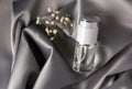 Luxury cosmetics concept. Still life on a shiny delicate gray fabric