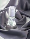 Luxury cosmetics concept. Still life on a shiny delicate gray fabric