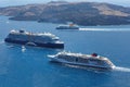 Luxury cruise liners close to each other in a strait near Santorini island, Greece.