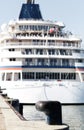 Luxury cruise ship docked in port. Front view of passenger vessel. Selective focus. Vintage Color Grading Royalty Free Stock Photo