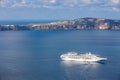 Luxury cruise ship sailing around Santorini island, Aegean sea in Greece. Royalty Free Stock Photo