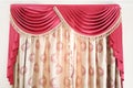 Luxury curtains with a red lambrequins on the Royalty Free Stock Photo