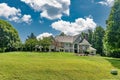 Luxury custom built hillside home with beautifully designed front yard and lawn in a residential area in Virginia